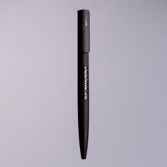 Round charger with a helicopter landing pad and a small drone, next to it the charging cable